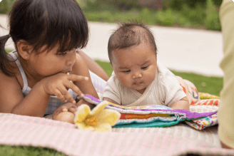 siblings reading book