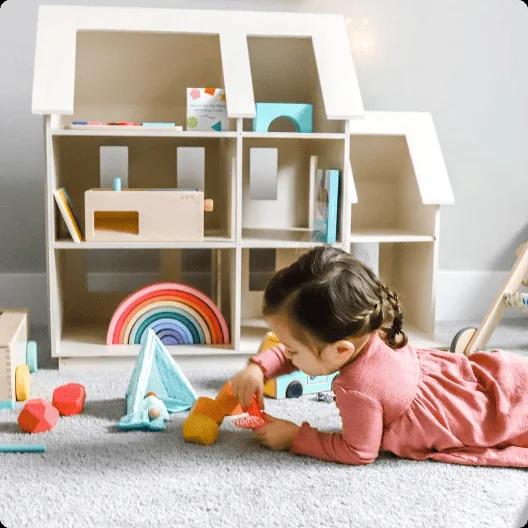 Toddler with toys from The Free Spirit