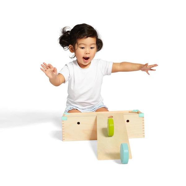 Child playing with block set ramp image