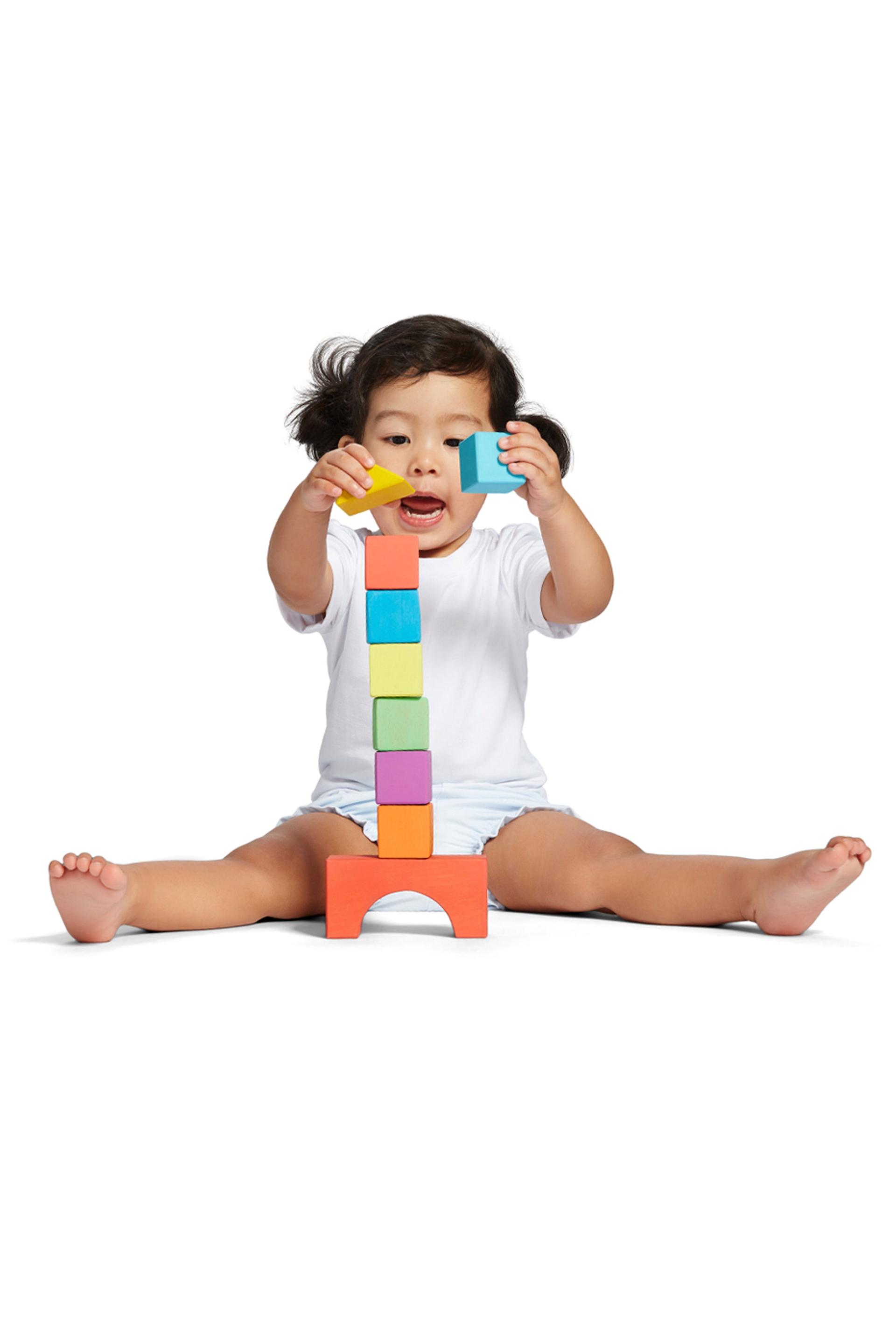 Child stacking blocks image